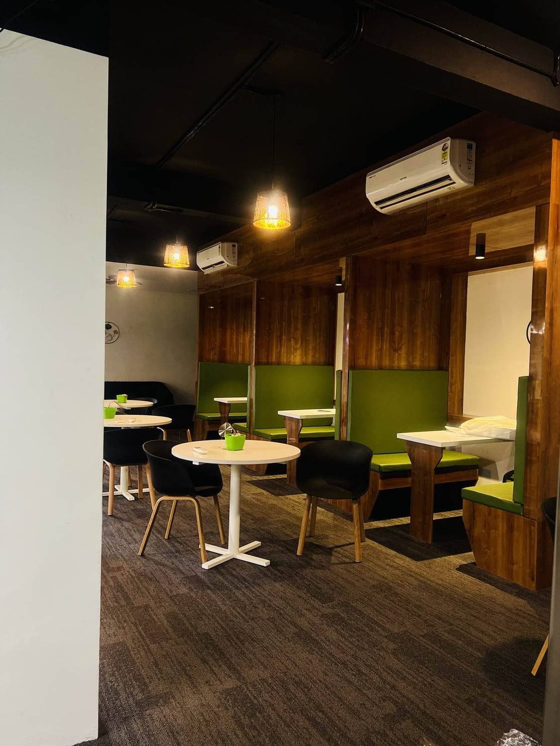 Lounge booths and cafe tables at Workco
