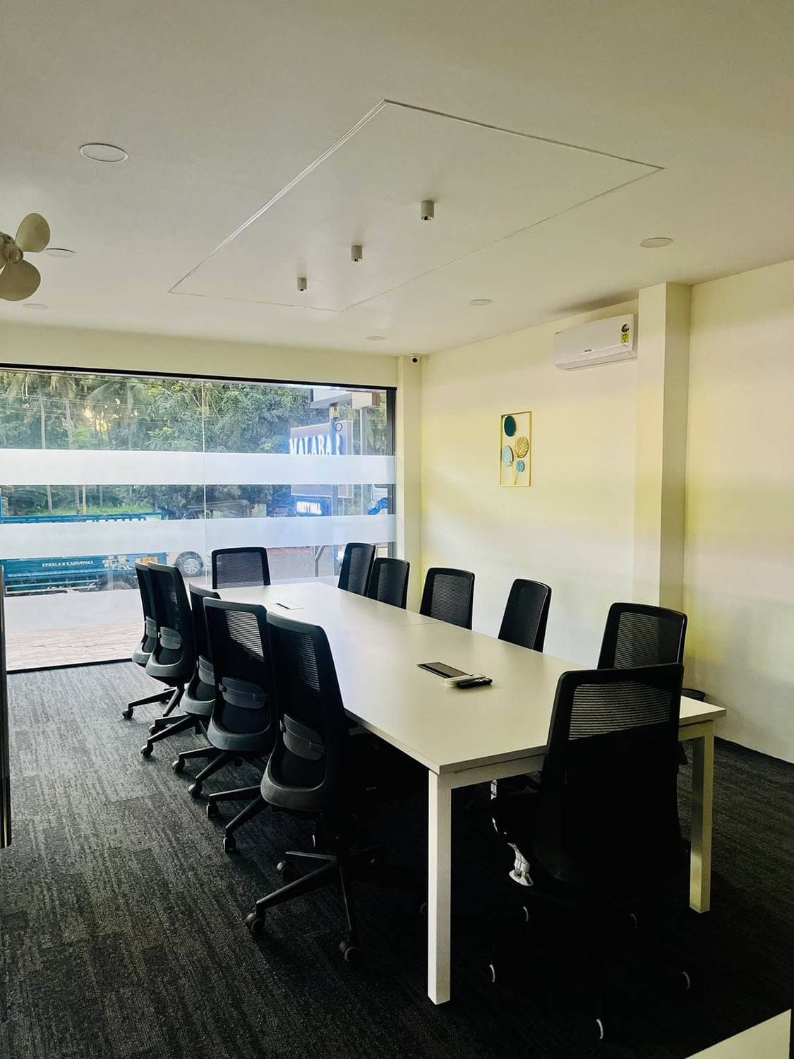 Workco conference room with a long table and chairs