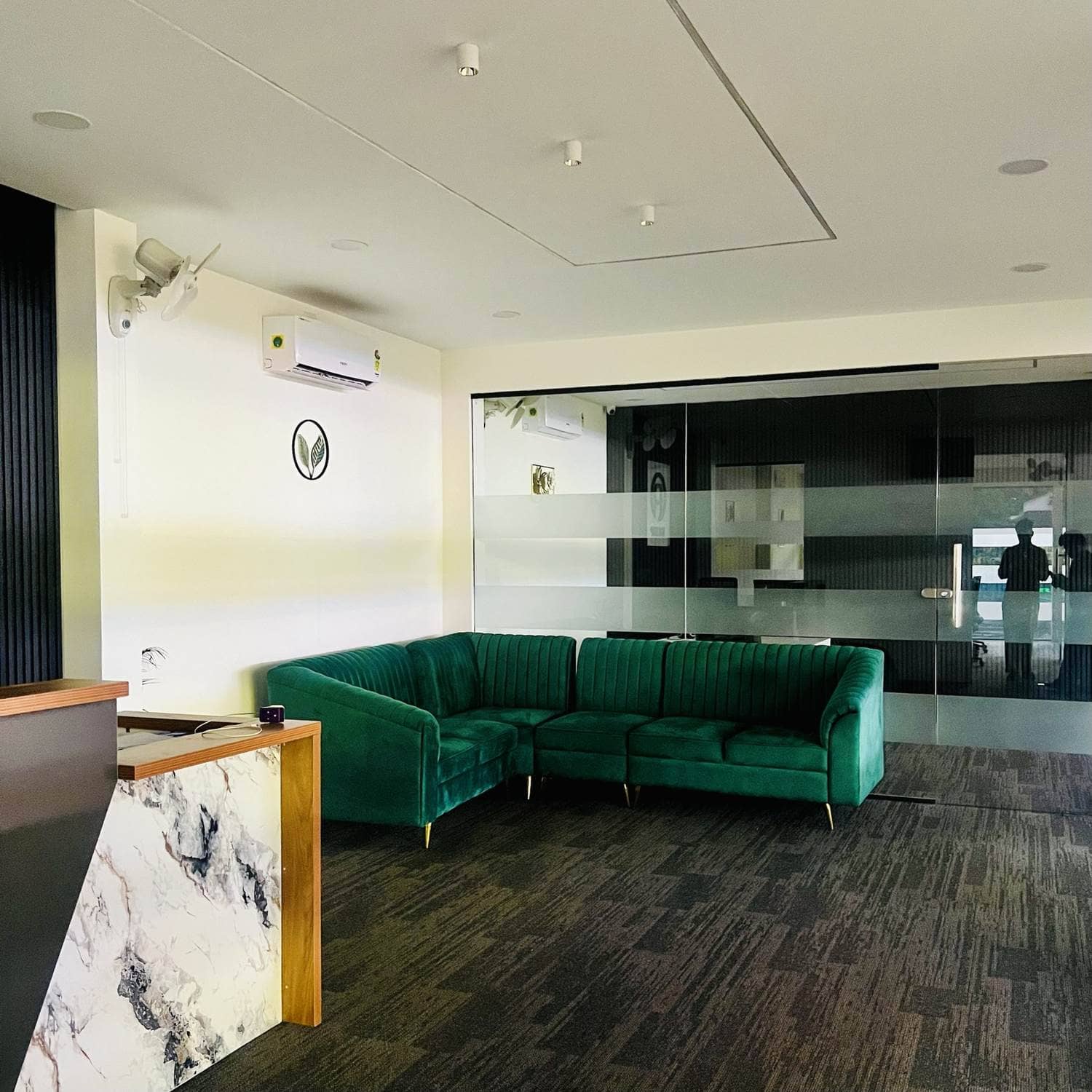 Workco reception with a glass meeting room